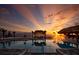 Stunning sunset view over a resort-style pool at 450 Margaritaville Ave, Daytona Beach, FL 32124