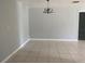 Neutral dining room boasts tile flooring, chandelier, and soothing gray walls at 1110 Deltona Blvd, Deltona, FL 32725