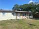 Cozy single-story home with stucco siding, front porch, and well-kept lawn under a bright blue sky at 1110 Deltona Blvd, Deltona, FL 32725