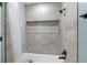 Clean bathroom with updated fixtures, tile shower, and neutral colors at 1412 Ruthbern Rd, Daytona Beach, FL 32114