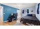 Bedroom with a bed, desk, and chair perfect for gaming and work at 1412 Ruthbern Rd, Daytona Beach, FL 32114
