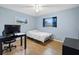 Bedroom with a bed, desk, and chair, ideal for a home office at 1412 Ruthbern Rd, Daytona Beach, FL 32114