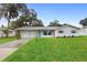 Charming ranch home with freshly painted exterior and landscaped lawn at 1412 Ruthbern Rd, Daytona Beach, FL 32114