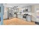 Modern kitchen with stainless steel appliances and granite countertops at 1412 Ruthbern Rd, Daytona Beach, FL 32114