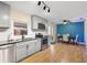 Updated kitchen with gray cabinets, stainless steel appliances, and breakfast nook at 1412 Ruthbern Rd, Daytona Beach, FL 32114