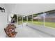 Relaxing screened porch overlooking the backyard at 1412 Ruthbern Rd, Daytona Beach, FL 32114