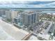 Aerial view of beachfront building with parking and ocean access at 3703 S Atlantic Ave # 501, Daytona Beach Shores, FL 32118