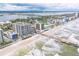 Breathtaking aerial view of beachfront condos, a fishing pier, and the scenic coastline, showcasing the coastal lifestyle at 3703 S Atlantic Ave # 501, Daytona Beach Shores, FL 32118