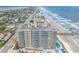 Aerial view of beachfront building, showcasing its prime location near the ocean and nearby attractions at 3703 S Atlantic Ave # 501, Daytona Beach Shores, FL 32118