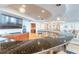 Modern bar area featuring a sleek countertop, dark wood cabinets, and contemporary lighting fixtures at 3703 S Atlantic Ave # 501, Daytona Beach Shores, FL 32118