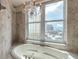 Bright bathroom boasts large soaking tub with jets and beautiful views of the city and ocean at 3703 S Atlantic Ave # 501, Daytona Beach Shores, FL 32118