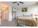 Spacious bedroom with a brass bed frame and large windows at 3703 S Atlantic Ave # 501, Daytona Beach Shores, FL 32118