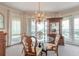 Open dining area with natural light, chandelier, and exterior views at 3703 S Atlantic Ave # 501, Daytona Beach Shores, FL 32118