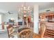 Open concept dining area features a chandelier and access to the kitchen and living room at 3703 S Atlantic Ave # 501, Daytona Beach Shores, FL 32118