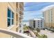 View from the balcony of nearby buildings, parking, and beach access at 3703 S Atlantic Ave # 501, Daytona Beach Shores, FL 32118