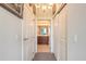 Hallway with carpet flooring leads to an en suite bathroom and has sliding closet doors at 3703 S Atlantic Ave # 501, Daytona Beach Shores, FL 32118