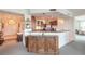 Well-lit kitchen with stainless steel appliances and counter seating at 3703 S Atlantic Ave # 501, Daytona Beach Shores, FL 32118