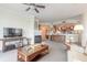 This open concept living room features a fireplace and access to the kitchen at 3703 S Atlantic Ave # 501, Daytona Beach Shores, FL 32118