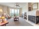 Bright living room showcasing a fireplace and expansive windows with views at 3703 S Atlantic Ave # 501, Daytona Beach Shores, FL 32118