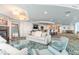 Comfortable lounge area with sofa, chairs, and fireplace, perfect for relaxing and socializing with friends at 3703 S Atlantic Ave # 501, Daytona Beach Shores, FL 32118