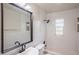 Bright, renovated bathroom features modern black fixtures, large mirror, and subway tile at 1809 Green Pl, Ormond Beach, FL 32174