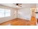 Spacious living room with wood floors, natural light, and a view of the hallway at 1809 Green Pl, Ormond Beach, FL 32174