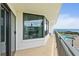 Wide balcony overlooking a pool and ocean view, offering serene outdoor enjoyment at 2555 S Atlantic Ave # 207, Daytona Beach Shores, FL 32118
