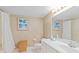This bathroom features a shower, toilet, and vanity with mirror at 2555 S Atlantic Ave # 207, Daytona Beach Shores, FL 32118