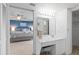 This white bathroom offers a stylish vanity with seated makeup area at 2555 S Atlantic Ave # 207, Daytona Beach Shores, FL 32118