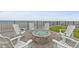 Cozy outdoor fire pit surrounded by Adirondack chairs, near the beach at 2555 S Atlantic Ave # 207, Daytona Beach Shores, FL 32118