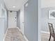 This hallway boasts wood floors and a decorative rug at 2555 S Atlantic Ave # 207, Daytona Beach Shores, FL 32118