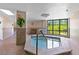 Enjoy relaxing in the building's indoor hot tub with tile flooring and views of the lawn and building's exterior at 2555 S Atlantic Ave # 207, Daytona Beach Shores, FL 32118
