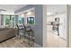 Bright kitchen and living area with bar seating offering an open concept and comfortable condo living at 2555 S Atlantic Ave # 207, Daytona Beach Shores, FL 32118