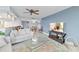 Living room featuring open floor plan, modern furnishings, and a flat screen TV at 2555 S Atlantic Ave # 207, Daytona Beach Shores, FL 32118