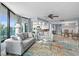 Living room flows into kitchen and dining room and features a balcony with ocean views at 2555 S Atlantic Ave # 207, Daytona Beach Shores, FL 32118