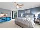 Well-lit main bedroom featuring a king bed, balcony, and ensuite bathroom at 2555 S Atlantic Ave # 207, Daytona Beach Shores, FL 32118