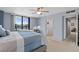 This main bedroom features water view, ceiling fan, and ensuite bath at 2555 S Atlantic Ave # 207, Daytona Beach Shores, FL 32118