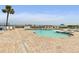 Beautiful pool area with lounge chairs, tables, and a view of the ocean at 2555 S Atlantic Ave # 207, Daytona Beach Shores, FL 32118