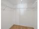 View of the walk-in closet with custom shelving at 2555 S Atlantic Ave # 207, Daytona Beach Shores, FL 32118