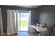 Bedroom featuring a sliding glass door to the backyard and space for a desk at 2600 Shortleaf, Kissimmee, FL 34746