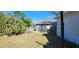 Spacious backyard featuring lush greenery, satellite dish, and ample room for outdoor activities at 250 Hickory Ave, Orange City, FL 32763