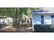 View of a backyard showing the fence, water conditioning equipment, and sparse groundcover at 250 Hickory Ave, Orange City, FL 32763