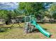 Backyard playset including a slide, swing, and climbing area, great for outdoor fun and activities at 250 Hickory Ave, Orange City, FL 32763