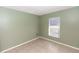 Cozy bedroom with tiled floor and a window that provides natural light at 250 Hickory Ave, Orange City, FL 32763