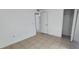 Bedroom with tile flooring, white walls, closet, and ample natural light at 250 Hickory Ave, Orange City, FL 32763