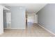 Bright living room featuring neutral paint, tile flooring, and sliding glass doors to let in natural light at 250 Hickory Ave, Orange City, FL 32763