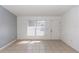 An open and bright living room with ceramic tile and a fresh coat of two-tone paint at 250 Hickory Ave, Orange City, FL 32763