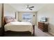 Main bedroom with a double bed and view of the lake at 811 Grand Park Ct, Deland, FL 32724