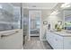 Elegant bathroom with double vanity, large shower, and bedroom view at 9777 Sw 63Rd Loop, Ocala, FL 34481