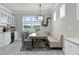 Elegant dining area with a built-in banquette and a large window at 9777 Sw 63Rd Loop, Ocala, FL 34481